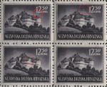 White dot below 12 in denomination (the first stamp)