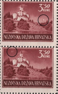 Colored dot above the forest on the right (the upper stamp)
