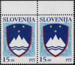 Blue dot above letter V in SLOVENIJA