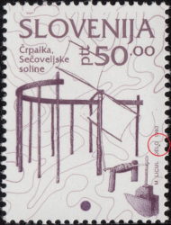 Slovenia, error on postage stamp: Colored dot below letters L and O in DELO