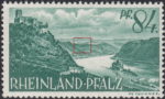 Germany Rheinland-Pfalz postage stamp error:  Colored spot in the hill in the center.