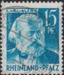 Germany Rheinland-Pfalz postage stamp error:  Colored dot on shirt above letter A in RHEINLAND.