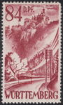 Germany Wuerttemberg postage stamp error: White dot in embankment above the road.
