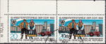 GDR Workers festival postage stamp plate flaw Mud protector on tractor broken on top.