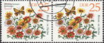 GDR 1982 Spring Flowers Chrysanthemum carinatum. postage stamp plate flaw Thickening on letter n in Carinatum.