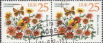 GDR 1982 Spring Flowers Chrysanthemum carinatum. postage stamp plate flaw Both butterfly’s antennas broken.