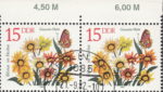 GDR 1982 Spring Flowers Gazania Hybr. postage stamp plate flaw White dot on stem of the top yellow flower.
