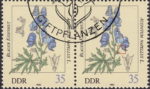 GDR 1982 flowers Aconitum Nappelus postage stamp plate flaw Thin line below the right flower.