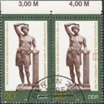 GDR 1983 Amazon statue postage stamp plate flaw Dot left from letters E and R of Berlin.