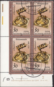 GDR 1983 Sand Glasses and Sundials postage stamp plate flaw White circle touching the left frame, next to letters a and l of Äquatorial.