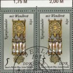 GDR 1983 Sand Glasses and Sundials postage stamp plate flaw Yellow dot on central vertical element of the clock.