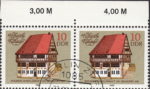 GDR 1983 Old town halls postage stamp plate flaw The third bottom window from the left on white wall damaged at the bottom.