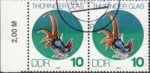 GDR 1983 Glass of Thuringia postage stamp plate flaw Additional white spot on rooster’s leg.