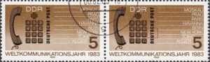 GDR 1983 World Communications Year postage stamp plate flaw Letter T of DEUTSCHE broken on top.