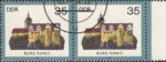 GDR 1984 Castles Burg Ranis postage stamp plate flaw Colored spot on the wall above letter U of BURG.