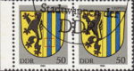 GDR 1984 Coat of Arms Leipzig postage stamp plate flaw Small whitening on the first vertical blue line.
