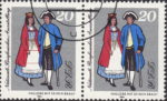 GDR 1984 National Stamp Exhibition postage stamp plate flaw Thin blue line on woman’s dress, below left hand.