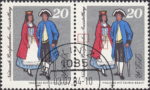 GDR 1984 National Stamp Exhibition postage stamp plate flaw Letter k in Briefmarken broken, second vertical wrinkle on woman’s dress broken.