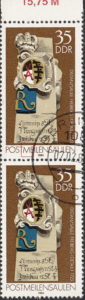 GDR 1984 Postal milestones postage stamp plate flaw Right vertical stroke of letter M in POSTMEILENSÄULEN broken.