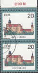 GDR 1985 Castle Rochsburg postage stamp plate flaw Colored dot between the forest and the left frame.