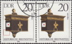 GDR 1985 Antique Mailboxes postage stamp plate flaw Small thin line below the left side of the mailbox.