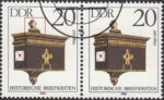 GDR 1985 Antique Mailboxes postage stamp plate flaw Colored spot right from the top ornament.
