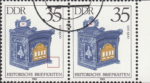 GDR 1985 Antique Mailboxes postage stamp plate flaw Small blue spot next to the lower right corner of the mailbox.