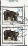 GDR 1985 Wildlife Preservation postage stamp plate flaw Tiny indentation on top inner frame above letter r in Brillenbär.