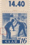 Germany SAAR postage stamp error: Colored spot on left frame behind left worker’s thigh.